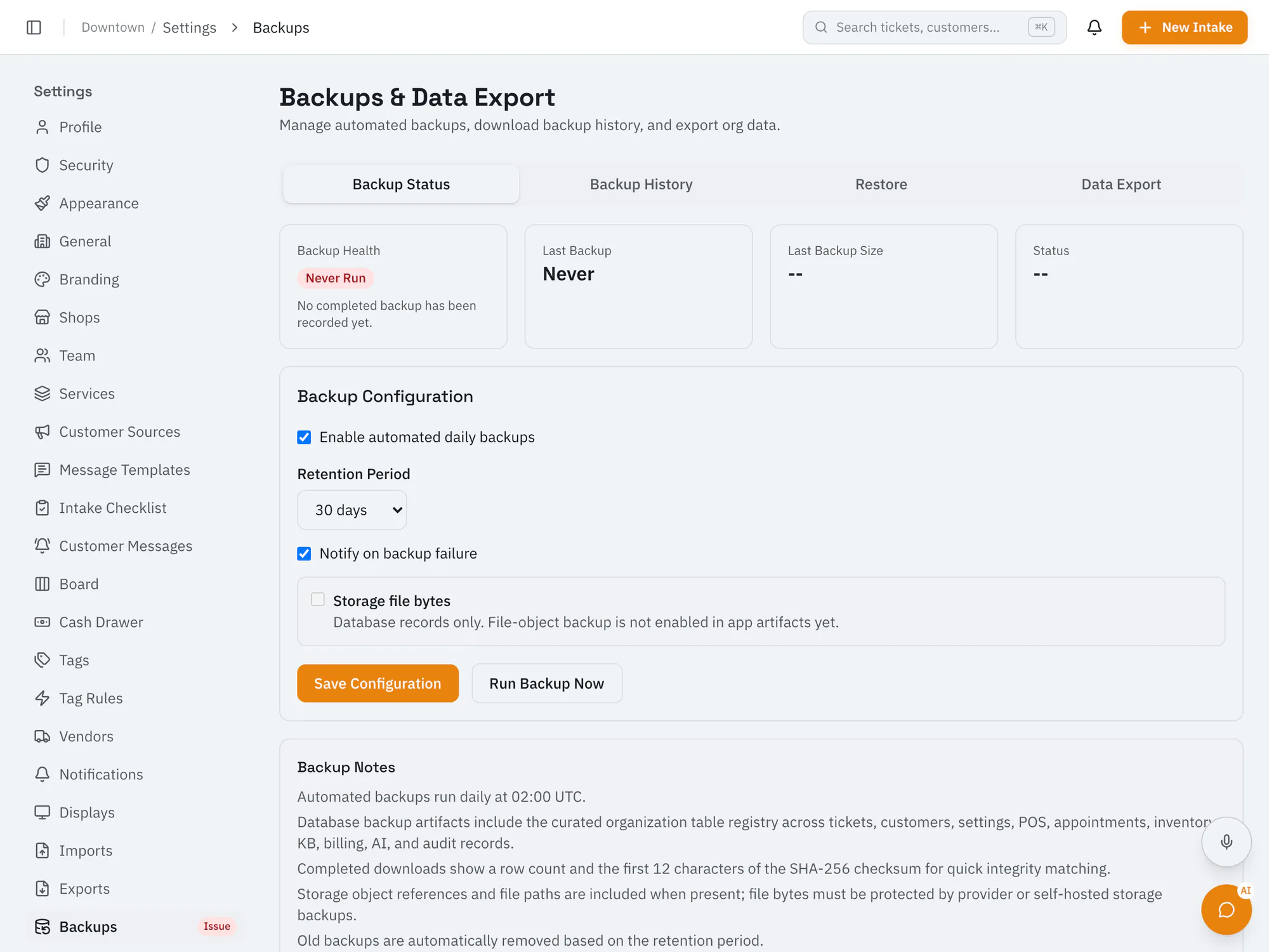 RepairOps backups and data export settings with backup status, history, restore, and schedule options.